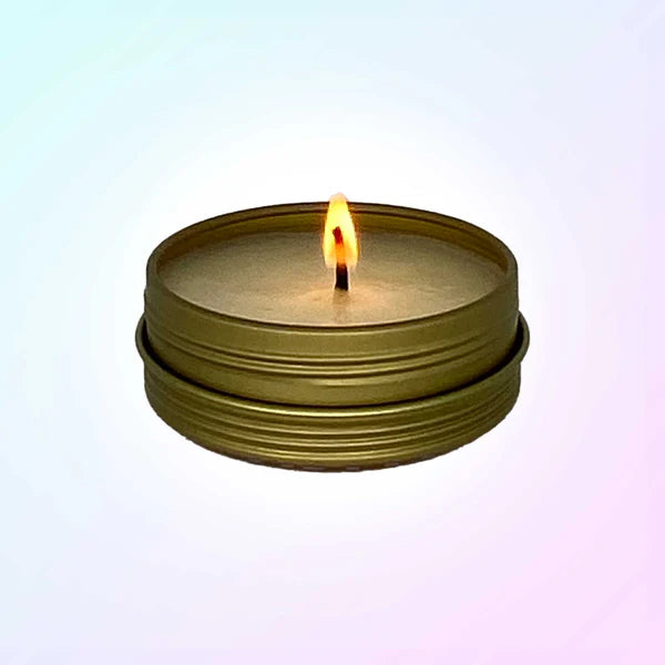 ErosWell ThreePlay massage candle burning with relaxing glow