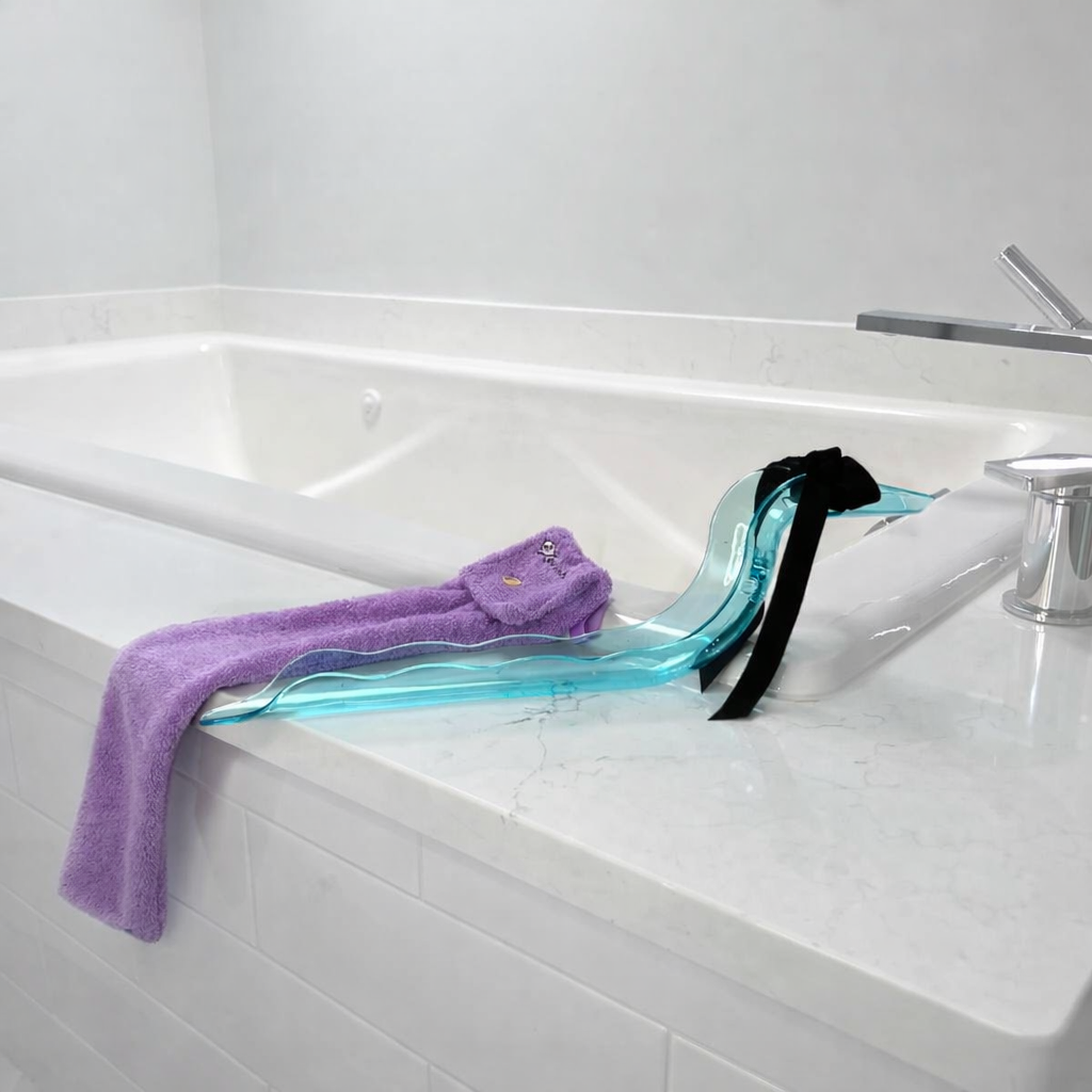 ErosWell WaterSlide mirror with Happy Sock drying sleeve beside a bathtub
